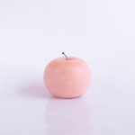 peach fruit on white table