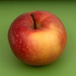 red apple fruit on green surface