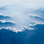 white clouds above silhouette of clouds at day
