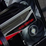 A close up of a computer with a red and black logo on it
