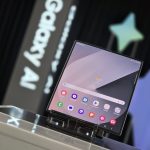 A person standing at a podium with a laptop on it