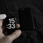a hand holding a black and white cube with a white and black logo