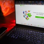 A laptop displays the duolingo homepage.