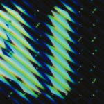 Abstract pattern of slanted lines and dots.