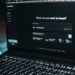 Laptop screen showing a search bar.