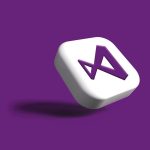 a white dice with a purple letter on it
