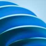 A close up of a blue object with a blurry background