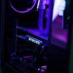 a close up of a computer with a purple light