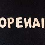a close up of a black surface with white letters