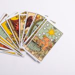 a deck of tarot cards on a white surface
