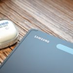 a cell phone and a mouse on a table