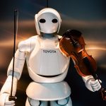 A white robot holding a violin and bow