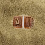 A close up of a word written in sand