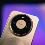 Close-up of a gold smartphone camera lens
