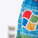 woman wearing blue Windows XP sweater