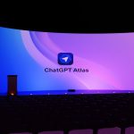 Large curved screen displays "chatgpt atlas" logo.