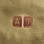 A close up of a word written in sand