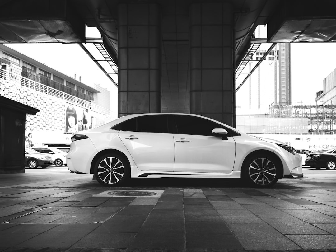 a white car parked in a parking lot