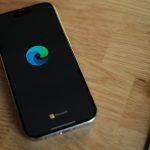 A close up of a cell phone on a table