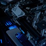 A computer motherboard with glowing blue lights.
