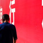 shallow focus photo of person in navy-blue T-shirt