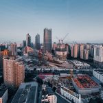 city skyline under blue sky during daytime