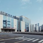gray and clear glass building under white clouds