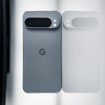 Two cell phones sitting next to each other