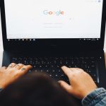 person using black laptop computer