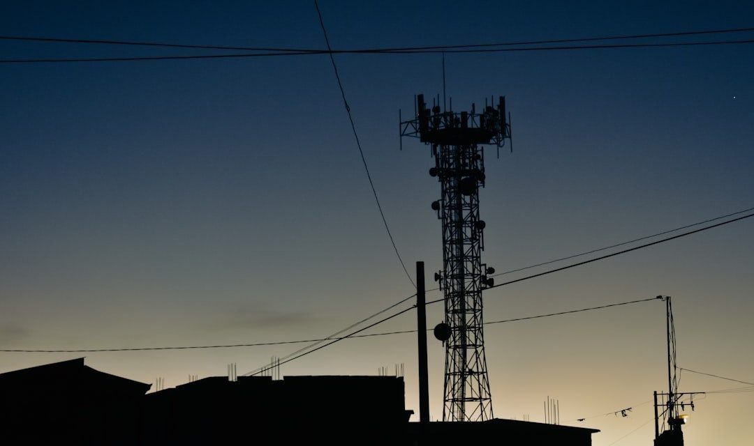 a tower with a cell phone on top of it