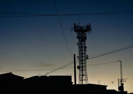 a tower with a cell phone on top of it