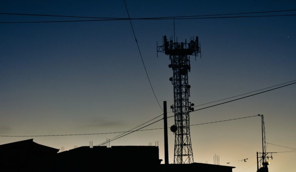 a tower with a cell phone on top of it