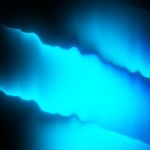 Abstract blue light pattern on a black background.