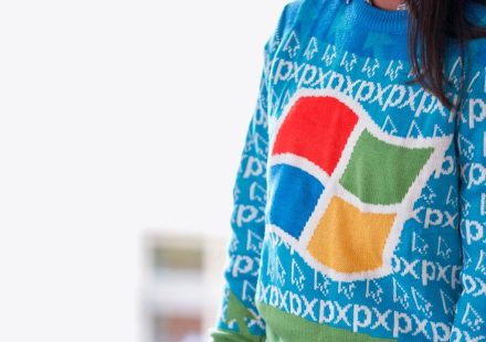 woman wearing blue Windows XP sweater