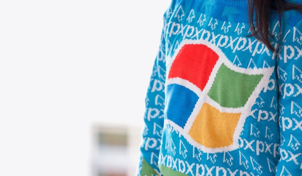woman wearing blue Windows XP sweater