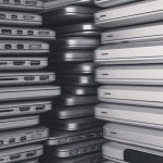 a room filled with lots of laptop computers