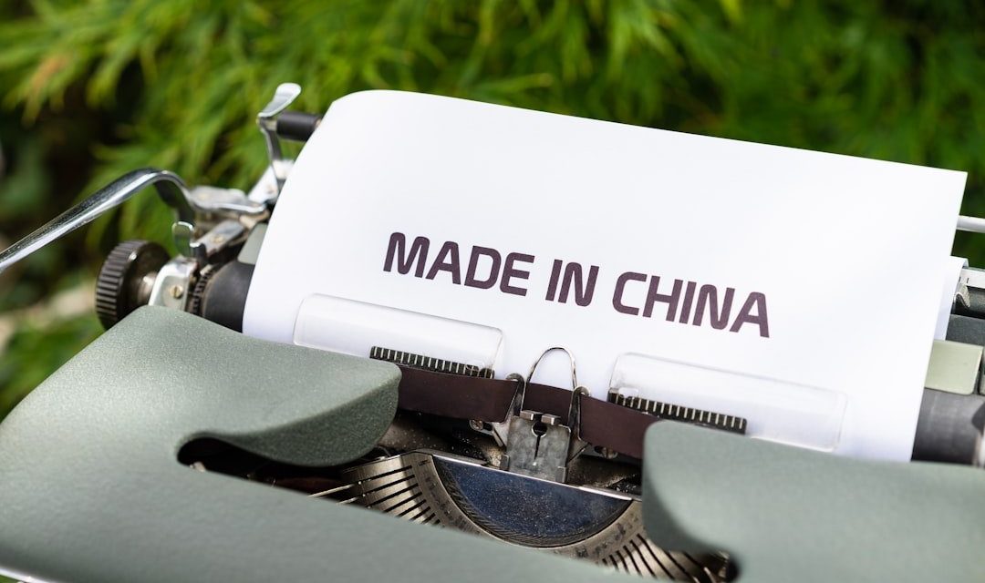 white and black typewriter on green grass during daytime