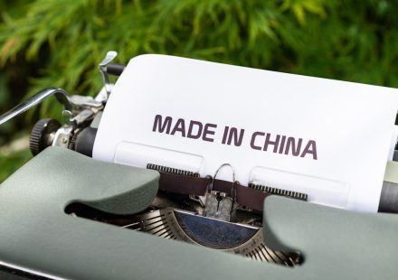 white and black typewriter on green grass during daytime