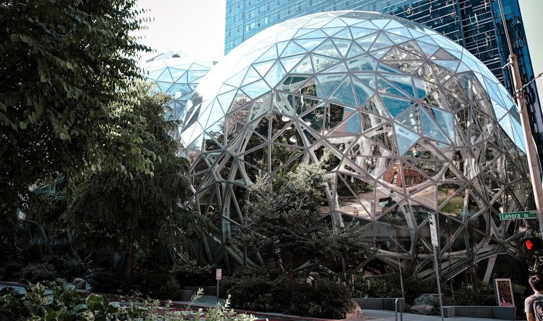 Modern glass spheres building with lush green trees