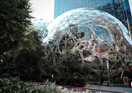 Modern glass spheres building with lush green trees