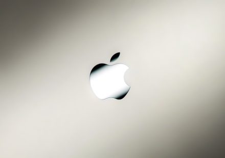 an apple logo on a silver background