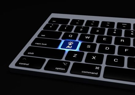 a close up of a keyboard on a black surface