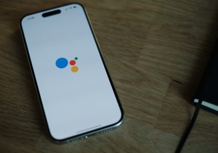 A cell phone sitting on top of a wooden table