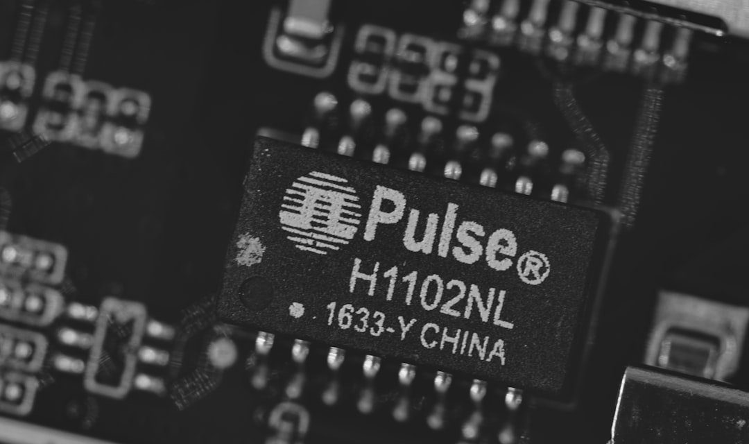 Close-up of a pulse h1102nl electronic component.
