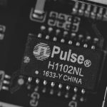 Close-up of a pulse h1102nl electronic component.