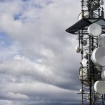 a satellite dish on a pole