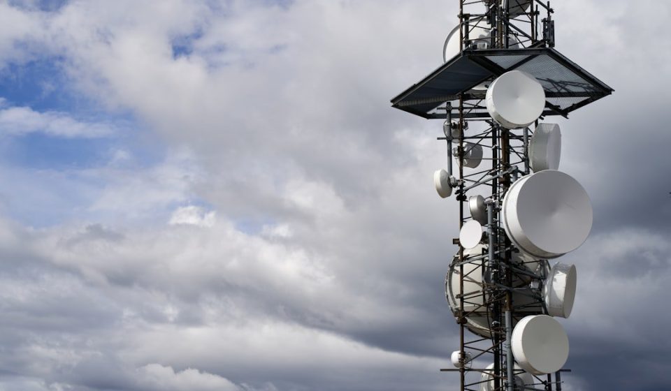 a satellite dish on a pole