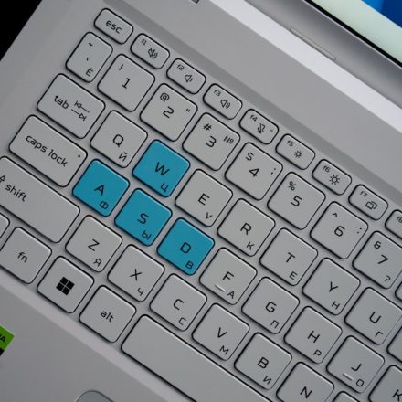 Close-up of a laptop keyboard with wasd keys highlighted.