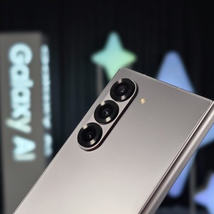A close up of a silver cell phone