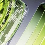 a close up of a green object on a white surface